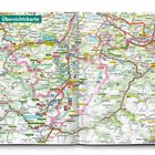 Übersichtskarte über eine Region mit Orten wie Füssen, Sonthofen, und vielen Straßen; zeigt Naturparks und Wanderwege.