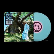 Text: RAVYN LENAË, Blue Island, THE THIRD ALBUM.  
Frau in blauem Kleid vor Baum, daneben blaue Schallplatte.