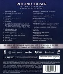 Text in großen Buchstaben: "ROLAND KAISER. 50 JAHRE. ALLE HITS. LIVE. EIN LEBEN FÜR DIE MUSIK." Darunter eine Trackliste.