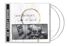 "Jeff Buckley Live at Sin-é" und "2CD Legacy Edition". Schwarz-weißes Foto einer Café-Szene mit Musikinstrumenten.