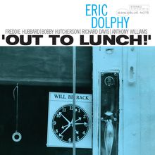 Oben steht "Eric Dolphy", darunter "Out to Lunch!". Ein Schild zeigt "Will Be Back" mit einer Uhr; eine Tür ist erkennbar.