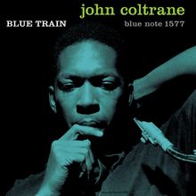 "BLUE TRAIN", "john coltrane", "blue note 1577". Ein Mann hält ein Saxophon und schaut nachdenklich. Dominante Blautöne.