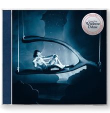 "Conan Gray Wishbone Deluxe" und "Includes Wall Poster" steht auf einem runden Emblem. Eine Person sitzt auf einer Schaukel.