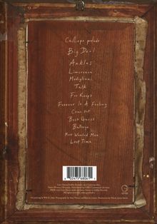 Eine Liste von Wörtern in Handschrift wie "Big Deal" und "Ankles" auf altem Holz, mit verblassten Kanten.