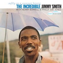„Softly as a summer breeze. THE INCREDIBLE JIMMY SMITH. Mit Kenny Burrell & Philly Joe Jones. 84200 Blue Note.“ Ein Mann ist unter einem blauen Regenschirm.