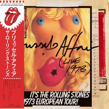 Japanischer Text links, handgeschriebener Titel "Brussels Affair (Live 1973)", Bild von einer Puppe, Tournamen unten.