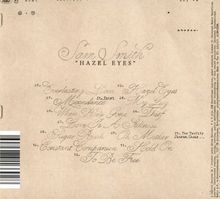 "Sam Smith 'HAZEL EYES'." Trackliste: "01. Everlasting Love, 02. Hazel Eyes" und weitere Titel. Beigefarbener Hintergrund.