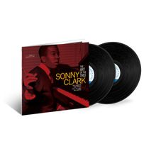 "Sonny Clark: The Art of the Trio" in gelber Schrift auf rotem Hintergrund. Zwei schwarze Vinylplatten sind sichtbar.