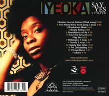 Trackliste mit Titeln wie "Broken Hearts Anthem" und "Simply Falling". Schwarze Frau vor geometrischem Hintergrund.
