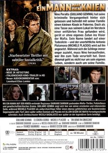 Covertext: "Ein Mann auf den Knien", "Starbesetzter Thriller mit subtiler Sozialkritik", Bild zeigt einen Mann und eine Frau.