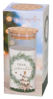 Der Text sagt "Wunscherfüller" und "Frohe Weihnachten". Auf einer Schachtel ist ein Tannenzweigkranz mit einem Weihnachtsbaum.