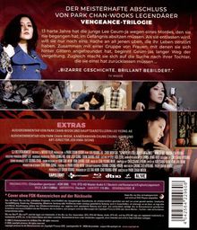 "Der meisterhafte Abschluss von Park Chan-Wooks legendärer Vengeance-Trilogie. 13 harte Jahre hat die junge Lee Geum-ja..."  
Die Illustration zeigt eine Frau in einer blauen Jacke. Unten sind Filmszenen und Informationen zu Extras.