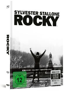 "Sylvester Stallone Rocky", "FSK ab 12 freigegeben". Jemand steht mit erhobenen Armen vor einer Statue.