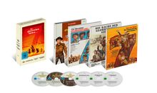 Buchboxen und DVDs der "Glorreichen Sieben", Illustrationen von Cowboys und westernartige Szenen, Altersfreigabe ab 16.