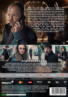 Texte: Mysteriöses Rätsel, Jahrmarktswelt, Bodensee. Titel: Schicksalsrad. FSK 12. Vordergrund: Mann mit Handy, ernster Ausdruck.