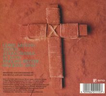 "COME AROUND, TILTED, JUDAS CRADLE, JC AUTO, FEELING BETTER, WALKING AWAY" in grüner Schrift. Ein Kreuz aus getrocknetem Material.