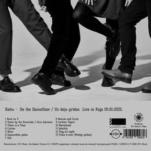 "Rahu - On the Dancefloor / Uz deju grīdas Live in Riga 05.01.2025." Schwarz-weiß-Foto von tanzenden Beinen.