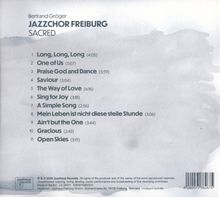 Bertrand Gröger, JAZZCHOR FREIBURG, SACRED. Eine Liste von 11 Songs mit Titeln und Zeiten, stilvoll auf grauem Hintergrund.