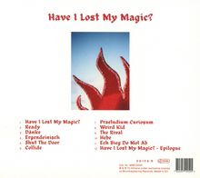 "Have I Lost My Magic?" Trackliste in roter Schrift. Ein rotes, gezacktes Objekt auf blauem Hintergrund ist zu sehen.