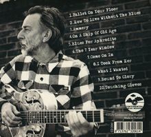 Texte: 1. Pallet On Your Floor, 2. How To Live Without The Blues, 3. Ammery, 4. On A Ship Of Old Age, 5. Blues For Aphrodite.

Ein Mann spielt Gitarre, trägt ein kariertes Hemd, mit Ziegelwand im Hintergrund. Continental Blue Heaven Logo.