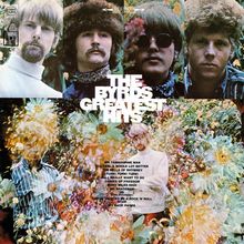 "The Byrds Greatest Hits." Vier Männerporträts oben, unten eine collageartige Blumenlandschaft. Songliste in weißem Text.