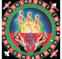 Text: "SHAM 69", "THE GAME". Illustration: Ein Herz mit Ketten und drei tanzende Figuren in einem Kreis ähnlich einem Roulette.