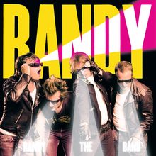 Text: "RANDY" oben in großen gelben Buchstaben; "RANDY THE BAND" im unteren Bereich, vier Männer mit Sonnenbrillen.