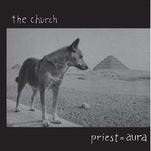"the church" oben, "priest=aura" unten. Ein Hund steht in einer wüstenartigen Landschaft mit Pyramiden.
