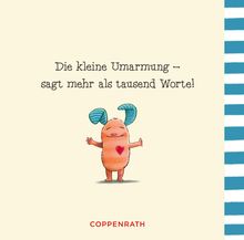 "Die kleine Umarmung – sagt mehr als tausend Worte!" Ein lächelndes Wesen mit blauen Ohren und Herz auf dem Bauch.