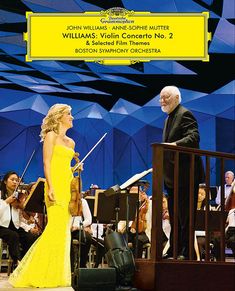 JOHN WILLIAMS · ANNE-SOPHIE MUTTER, WILLIAMS: Violin Concerto No. 2, BOSTON SYMPHONY ORCHESTRA. Eine Frau im gelben Kleid mit Geige.