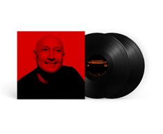 "PAUL KALKBRENNER THE ESSENCE". Rote Albumhülle mit Porträt eines lächelnden Mannes, daneben zwei schwarze Vinyl-Schallplatten.
