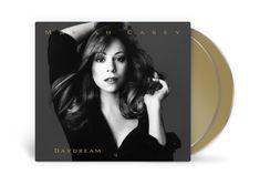 „Mariah Carey“ und „Daydream“ auf einem CD-Cover, schwarz-weißes Porträt einer Frau mit langen Haaren.