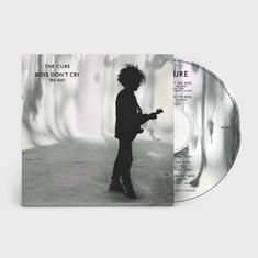 "The Cure, Boys Don't Cry (86 Mix)": Eine Silhouette einer Person mit Gitarre, daneben eine CD mit denselben Texten.