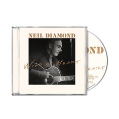 Text: "NEIL DIAMOND, Wild at Heart" – Ein CD-Cover zeigt einen Mann mit Akustikgitarre.