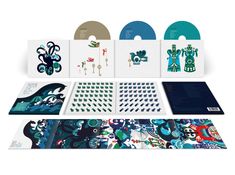 "Keane Under the Iron Sea". Buntes CD-Set mit Illustrationen von Meereswellen, Tieren und Schlüsseln.