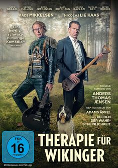 "Eine herrlich schwarzhumorige Komödie." Darunter stehen zwei Männer in der Natur, einer hält eine Gitarre, der andere eine Schaufel.