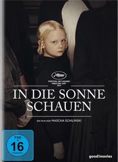 „IN DIE SONNE SCHAUEN“, FSK 16. Eine blonde, ernste Person zwischen dunklen Silhouetten. Festival de Cannes Logo.