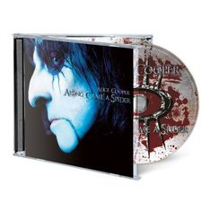 Texts: Alice Cooper, Along Came a Spider.  
Cover zeigt ein blasses Gesicht mit schwarzem Haar.