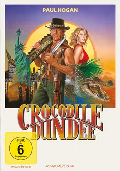 "Paul Hogan", "Crocodile Dundee". Illustration mit Statue, Stadt, Krokodil, Mann in Lederweste, Frau im roten Kleid.