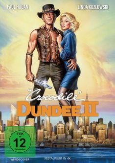 Text: "Paul Hogan", "Linda Kozlowski", "Crocodile Dundee II", "FSK ab 12", "Wendecover", "Restauriert in 4K". 

Illustration: Ein Paar vor einer Stadtsilhouette.