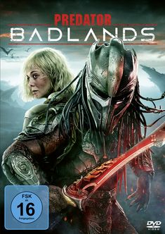 "Predator Badlands", FSK ab 16, Frau mit blonden Haaren und Helm, Hintergrund schwarz, mysteriöse Atmosphäre.