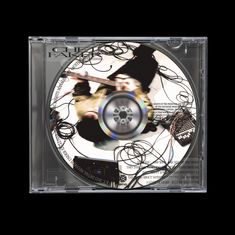 CD in Hülle, Aufdruck mit Kabelsalat, verschwommene Figur. Texte: "THIS TIME", "YOU NO", "WHO", "A LETTER OF LIGHT".