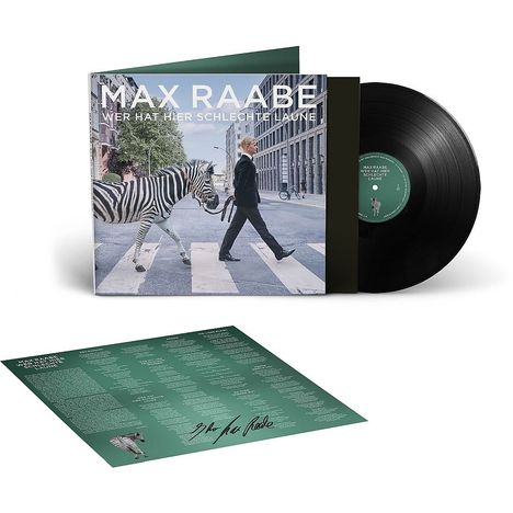 "MAX RAABE: WER HAT HIER SCHLECHTE LAUNE" auf einem Albumcover mit einem Mann, der ein Zebra über einen Zebrastreifen führt.