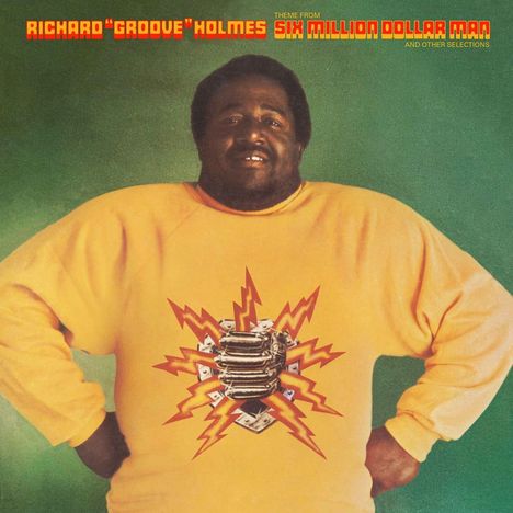 Oben steht: "RICHARD 'GROOVE' HOLMES SIX MILLION DOLLAR MAN". Ein Mann in gelbem Pullover mit Blitz-Design in der Mitte.