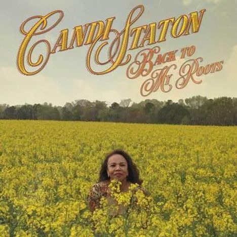 „Candi Staton Back to My Roots“, Frau in gelbem Blumenfeld vor einer Baumreihe im Hintergrund.