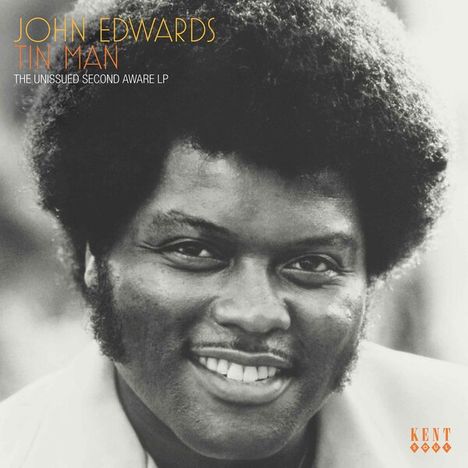 Text: JOHN EDWARDS TIN MAN, THE UNISSUED SECOND AWARE LP. Schwarzweißfoto eines lächelnden Mannes. Links unten Kent-Logo.