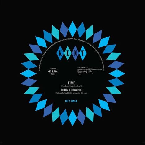 Text: KENT, TIME, John Edwards, CITY 109-A. 
Design: Kreisförmiges Logo mit blauen und lila Rautenmustern.