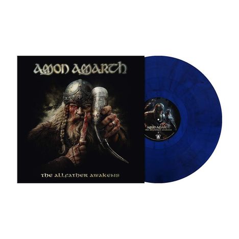 "Amon Amarth, The Allfather Awakens." Wikinger mit Helm und Trinkhorn, dazu eine blaue Schallplatte.