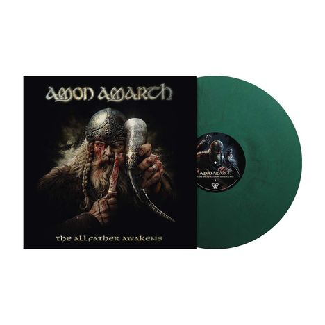 "Amon Amarth - The Allfather Awakens." Ein Krieger mit Helm und Trinkhorn, darauf ein grün-schwarzes Vinyl.