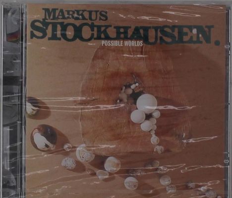 CD-Cover: Text "Markus Stockhausen. Possible Worlds" über einem Holzuntergrund mit weißen Kugeln.